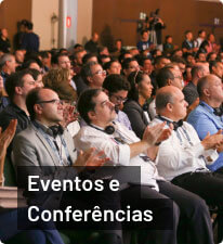 Pessoas na plateia de evento da StartSe; texto 'Eventos e Conferências' abaixo